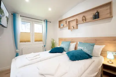Ein Bett oder Betten in einem Zimmer der Unterkunft Ostseecamp Ferienhaus 