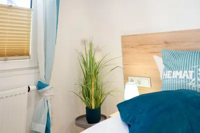 Ein Bett oder Betten in einem Zimmer der Unterkunft Ostseecamp Ferienhaus 