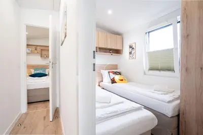 Ein Bett oder Betten in einem Zimmer der Unterkunft Ostseecamp Ferienhaus 