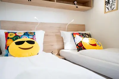 Ein Bett oder Betten in einem Zimmer der Unterkunft Ostseecamp Ferienhaus 