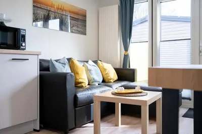 Ein Sitzbereich in der Unterkunft Ostseecamp Ferienhaus 