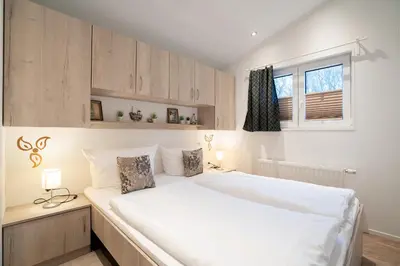 Ein Bett oder Betten in einem Zimmer der Unterkunft Ostseecamp Ferienhaus 