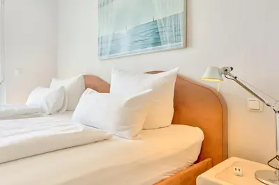 Ein Bett oder Betten in einem Zimmer der Unterkunft SeeVilla Scharbeutz