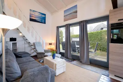 Ein Sitzbereich in der Unterkunft AMW8d Ferienhaus Moin