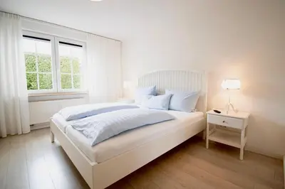 Ein Bett oder Betten in einem Zimmer der Unterkunft Villa Wilhelma Apartment A1 EG
