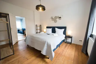 Ein Bett oder Betten in einem Zimmer der Unterkunft HejU - Design Neuer Altbau - gute Parkmöglichkeiten