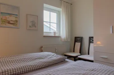Ein Bett oder Betten in einem Zimmer der Unterkunft Ferienwohnung Achtsam in Scharbeutz