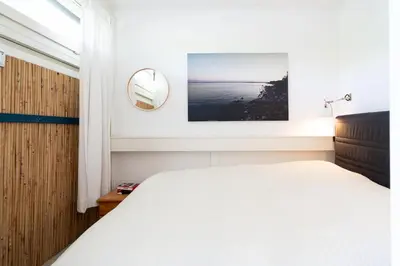 Ein Bett oder Betten in einem Zimmer der Unterkunft Ferienpark Sierksdorf App 180