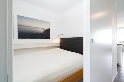 Ein Bett oder Betten in einem Zimmer der Unterkunft Ferienpark Sierksdorf App 180