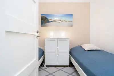 Ein Bett oder Betten in einem Zimmer der Unterkunft Ferienpark Sierksdorf App 148