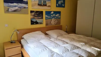Ein Bett oder Betten in einem Zimmer der Unterkunft PEMATRA FeWo Mollenhauer