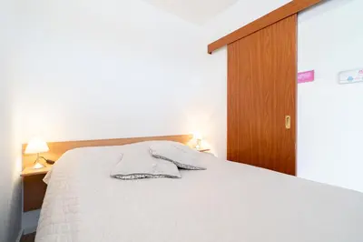 Ein Bett oder Betten in einem Zimmer der Unterkunft Ferienpark Sierksdorf App 241