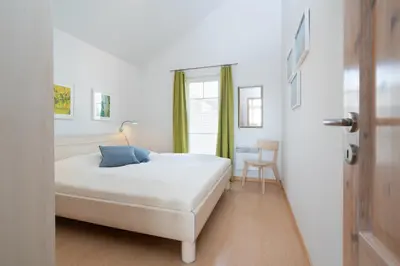 Ein Bett oder Betten in einem Zimmer der Unterkunft Strandpark Sierksdorf H088