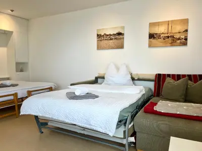 Ein Bett oder Betten in einem Zimmer der Unterkunft Strand Suite