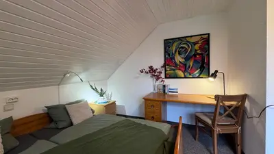 Ein Bett oder Betten in einem Zimmer der Unterkunft Scharbeutz Waldblick