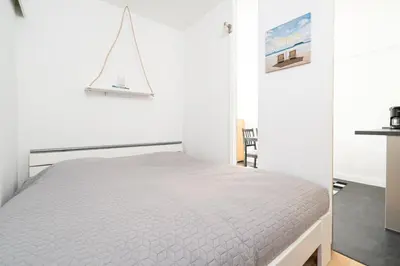 Ein Bett oder Betten in einem Zimmer der Unterkunft Panoramic Sierksdorf App C03-7