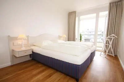 Ein Bett oder Betten in einem Zimmer der Unterkunft Meer & Strand - Haus Meeresstrand Ferienwohnung 205