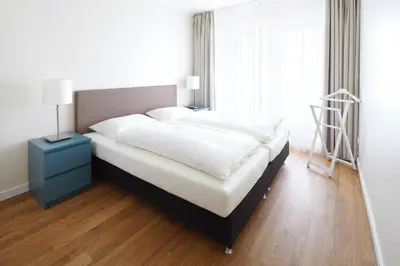 Ein Bett oder Betten in einem Zimmer der Unterkunft Meer & Strand - Haus Meeresstrand Ferienwohnung 202