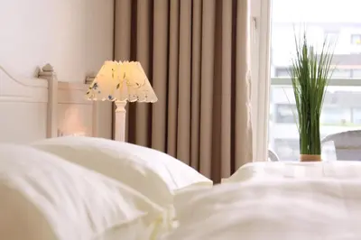 Ein Bett oder Betten in einem Zimmer der Unterkunft Meer & Strand - Haus Meeresstrand Ferienwohnung 313