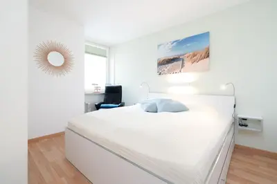Ein Bett oder Betten in einem Zimmer der Unterkunft Ferienpark Sierksdorf App 491 - Heimathafen