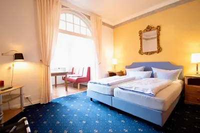 Ein Bett oder Betten in einem Zimmer der Unterkunft Villa Wilhelma Strandallee 146 Villa Wilhelma Apartment 4
