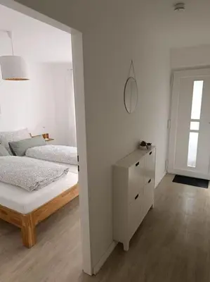 Ein Bett oder Betten in einem Zimmer der Unterkunft Strandnahe Ferienwohnung
