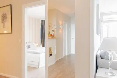 Ein Bett oder Betten in einem Zimmer der Unterkunft Ferienwohnung Residenz App. 911