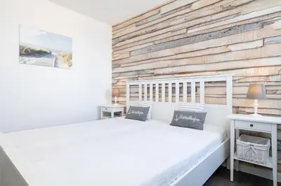 Ein Bett oder Betten in einem Zimmer der Unterkunft Ferienpark Sierksdorf App 388