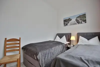 Ein Bett oder Betten in einem Zimmer der Unterkunft Die Insel Appartement 19