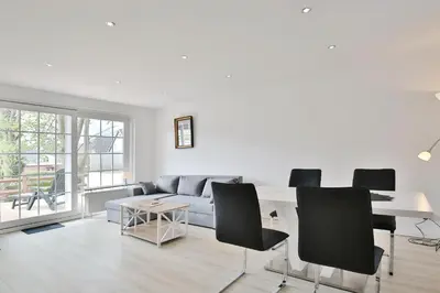 Ein Sitzbereich in der Unterkunft Haus Strandidyll Haus1