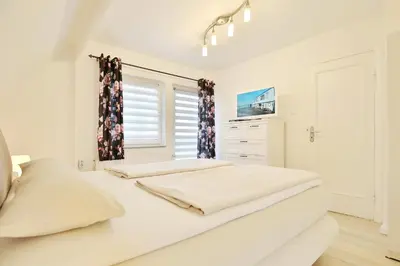 Ein Bett oder Betten in einem Zimmer der Unterkunft Haus Strandidyll Haus1