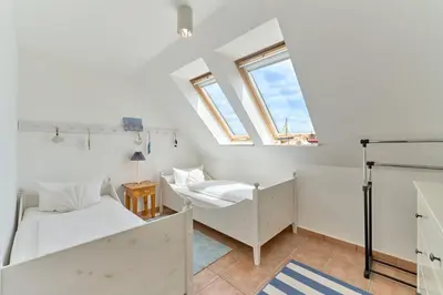 Ein Bett oder Betten in einem Zimmer der Unterkunft Hanseaten Residenz Sea Love Scharbeutz