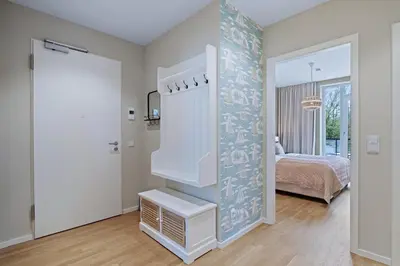Ein Bett oder Betten in einem Zimmer der Unterkunft Villa Godewindpark Travemünde 01