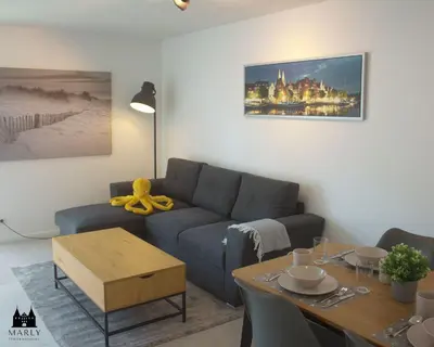 Ein Sitzbereich in der Unterkunft Ferienwohnung Marly