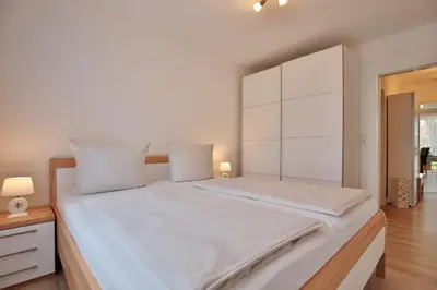 Ein Bett oder Betten in einem Zimmer der Unterkunft Kurparkresidenz Timmendorfer Strand Appartement 2
