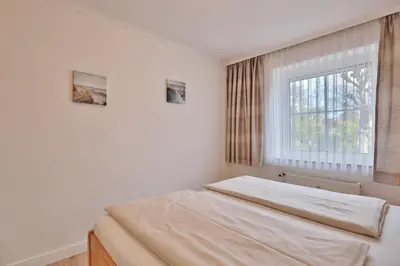 Ein Bett oder Betten in einem Zimmer der Unterkunft Kurparkresidenz Timmendorfer Strand Appartement 2