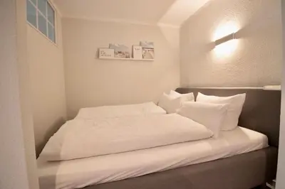 Ein Bett oder Betten in einem Zimmer der Unterkunft Strandliebe Travemünde