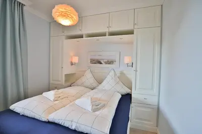 Ein Bett oder Betten in einem Zimmer der Unterkunft Strandmuschel