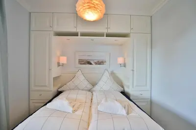 Ein Bett oder Betten in einem Zimmer der Unterkunft Strandmuschel
