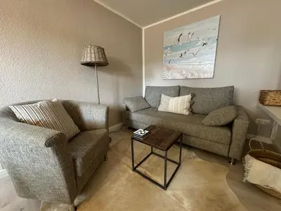 Ein Sitzbereich in der Unterkunft Waterkant Apartments