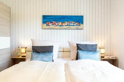 Ein Bett oder Betten in einem Zimmer der Unterkunft Ferienhaus Eastside - Niendorf