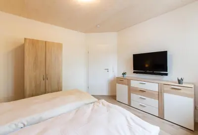Ein Bett oder Betten in einem Zimmer der Unterkunft Ferienhaus Eastside - Niendorf