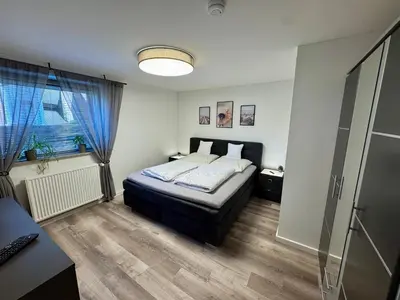 Ein Bett oder Betten in einem Zimmer der Unterkunft Apartment mit Garten und Pool in Ostseenähe