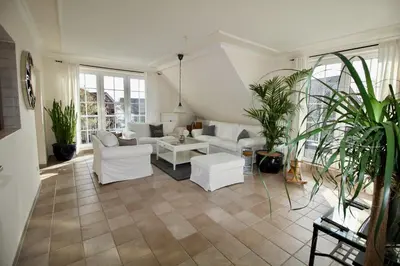 Ein Sitzbereich in der Unterkunft Hamptons House