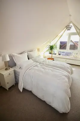 Ein Bett oder Betten in einem Zimmer der Unterkunft Hamptons House