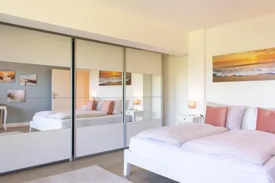 Ein Bett oder Betten in einem Zimmer der Unterkunft Ferienwohnung Küstenschatz - Timmendorfer Strand