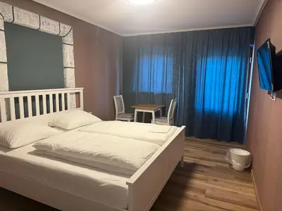 Ein Bett oder Betten in einem Zimmer der Unterkunft PENSION AMEDY