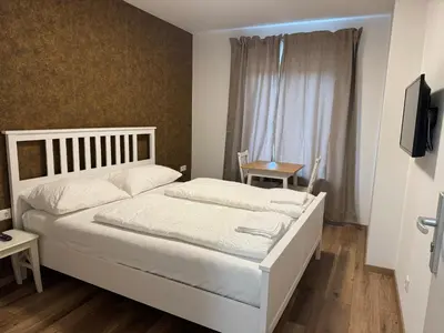 Ein Bett oder Betten in einem Zimmer der Unterkunft PENSION AMEDY