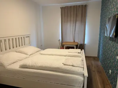 Ein Bett oder Betten in einem Zimmer der Unterkunft PENSION AMEDY