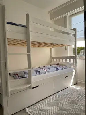Ein Bett oder Betten in einem Zimmer der Unterkunft Ferienwohnung Strandoase inklusive Terrasse und Parkplatz - Sonnenseite